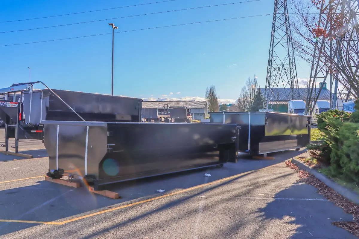 Roll-off dumpster ready for waste disposal at job site for 2 Yard Dumpster Rental in Bolton